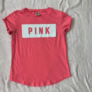 2 PINK shirts. Both shirts are a size XS.